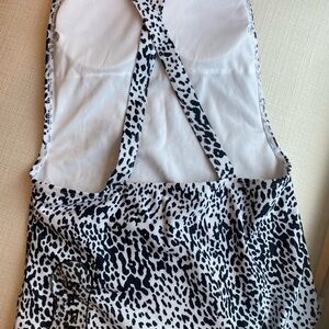 New Woman’s black and white cheetah print bathing suit with open back